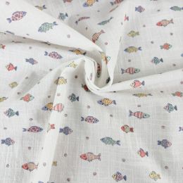 Tela algodón pececitos pastel.